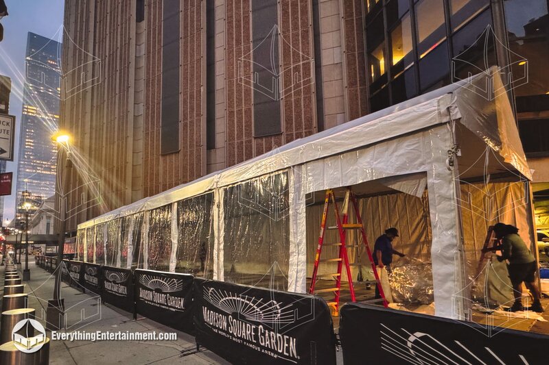 tent rental with walls set up at Madison Square Garden in NYC in the evening.