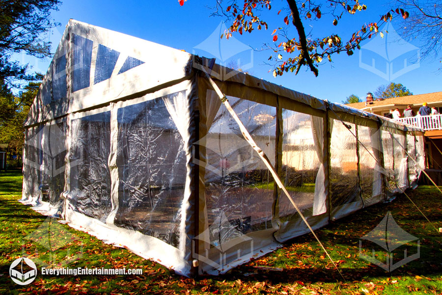 Clear sidewall setup on 30x60 tent with autumn leaves on the floor