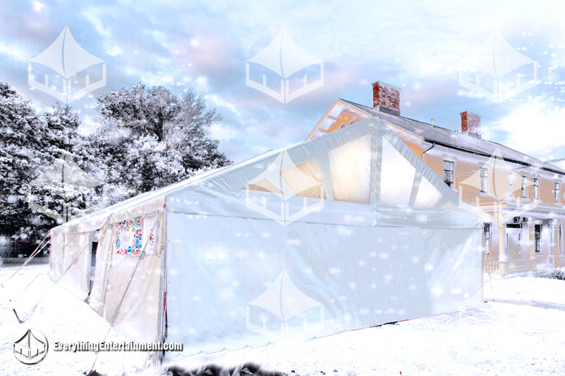 heated white tent setup on snow covered ground.