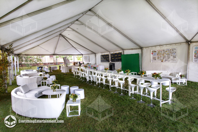 A chic corporate tent lounge with stylish seating, ideal for creating a relaxed and elegant atmosphere at your event.