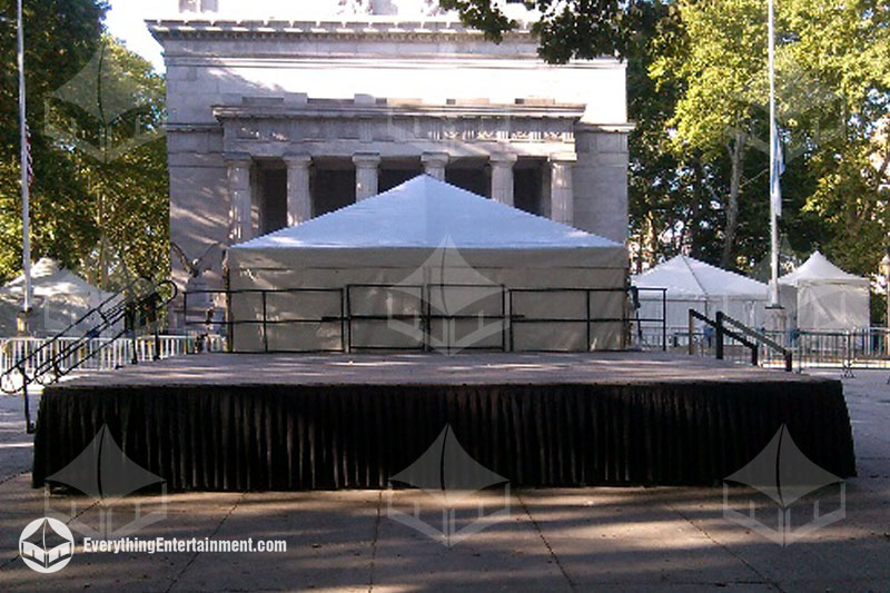 Portable BilJax Signature stage setup with black railing and skirts in front of General Grants Natio